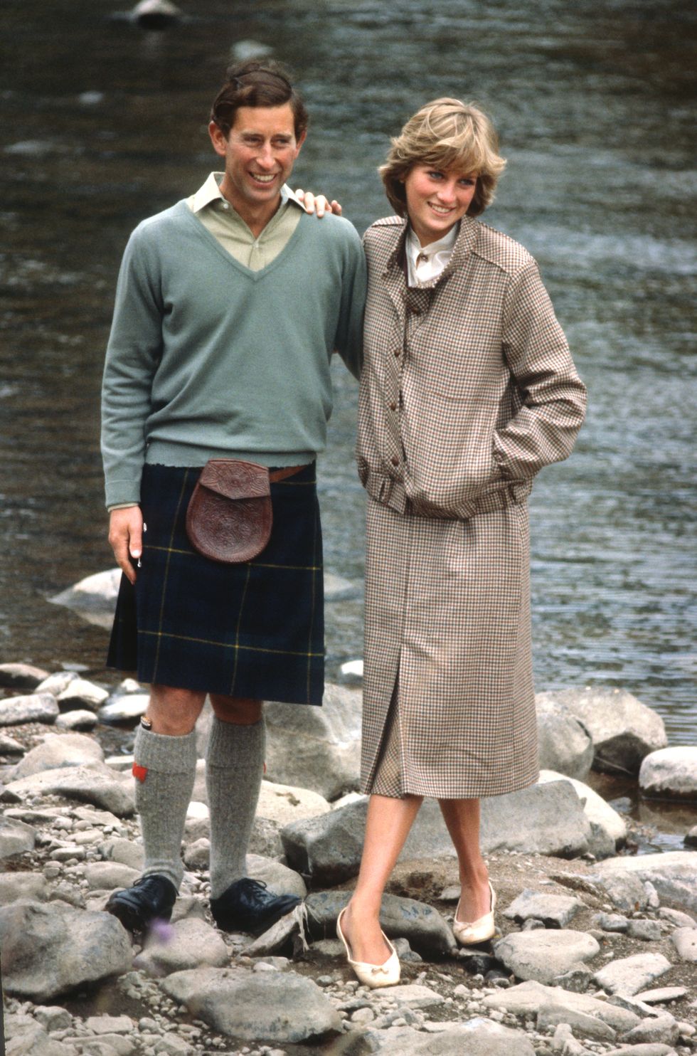 balmoral, united kingdom august 19 prince charles, prince of wales and diana, princess of wales, wearing a suit designed by bill pashley, pose for a photo on the banks of the river dee in the grounds of balmoral castle during their honeymoon on august 19, 1981 in balmoral, scotland photo by anwar husseingetty images