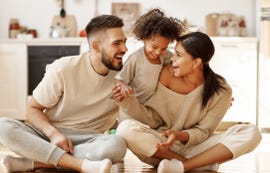 happy multiethnic family mom, dad and child laughing, playing