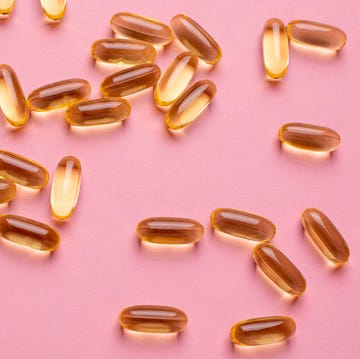 Vitamins Omega 3 6 9 fish oil , vitamin D on a pink background for health lifestyle vitamins omega 3 6 9 fish oil , vitamin d on a pink background for health lifestyle top view
