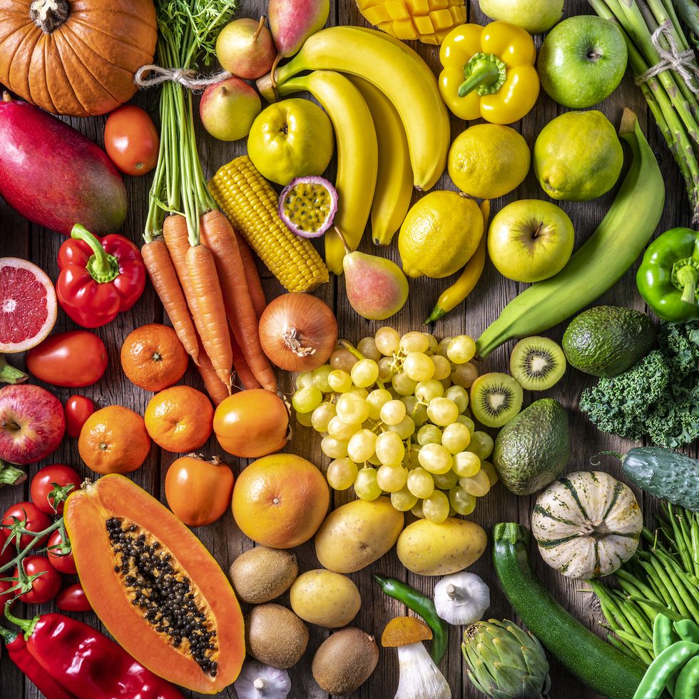 colorful vegetables and fruits vegan food in rainbow colors arrangement full frame