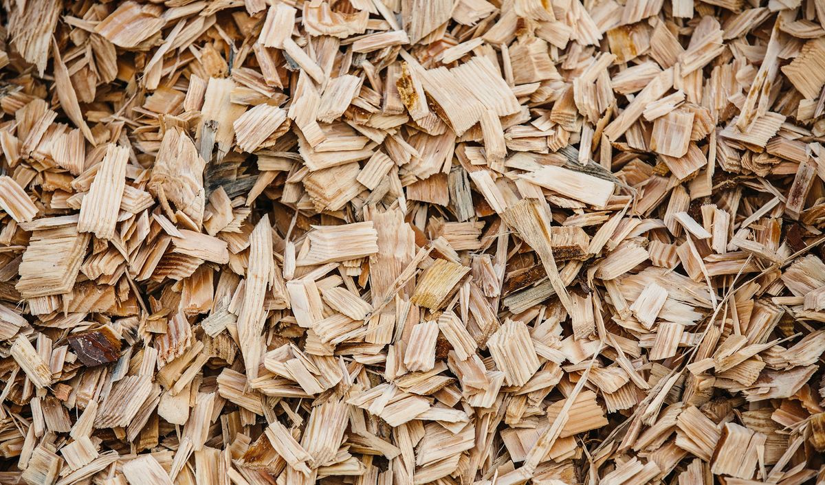 a close up view of a pile of various sized wood chipping