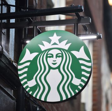 stoke on trent england   november 22 the american coffeehouse company, starbucks logo is seen outside one of its stores on november 22, 2020 in stoke on trent, england  photo by nathan stirkgetty images
