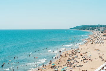 a crowded beach with people