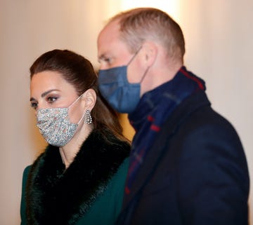 windsor, united kingdom   december 08 embargoed for publication in uk newspapers until 24 hours after create date and time catherine, duchess of cambridge and prince william, duke of cambridge wear face masks as they attend an event to thank local volunteers and key workers from organisations and charities in berkshire, who will be volunteering or working to help others over the christmas period in the quadrangle of windsor castle on december 8, 2020 in windsor, england during the event members of the royal family also listened to christmas carols performed by the salvation army band photo by max mumbyindigo   poolgetty images