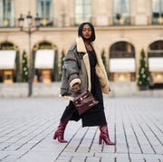 winter-dresses-on-amazon paris, france december 06 fashion blogger linaose wears a bombardier aviator browngray jacket with sheep wool inner lining from acne studio, a black slit dress from sancia, a burgundy leather bag kelly hermes 28, purple leather crocodile pattern high heeled pointy boots from bianca di, on december 06, 2020 in paris, france photo by edward berthelotgetty images