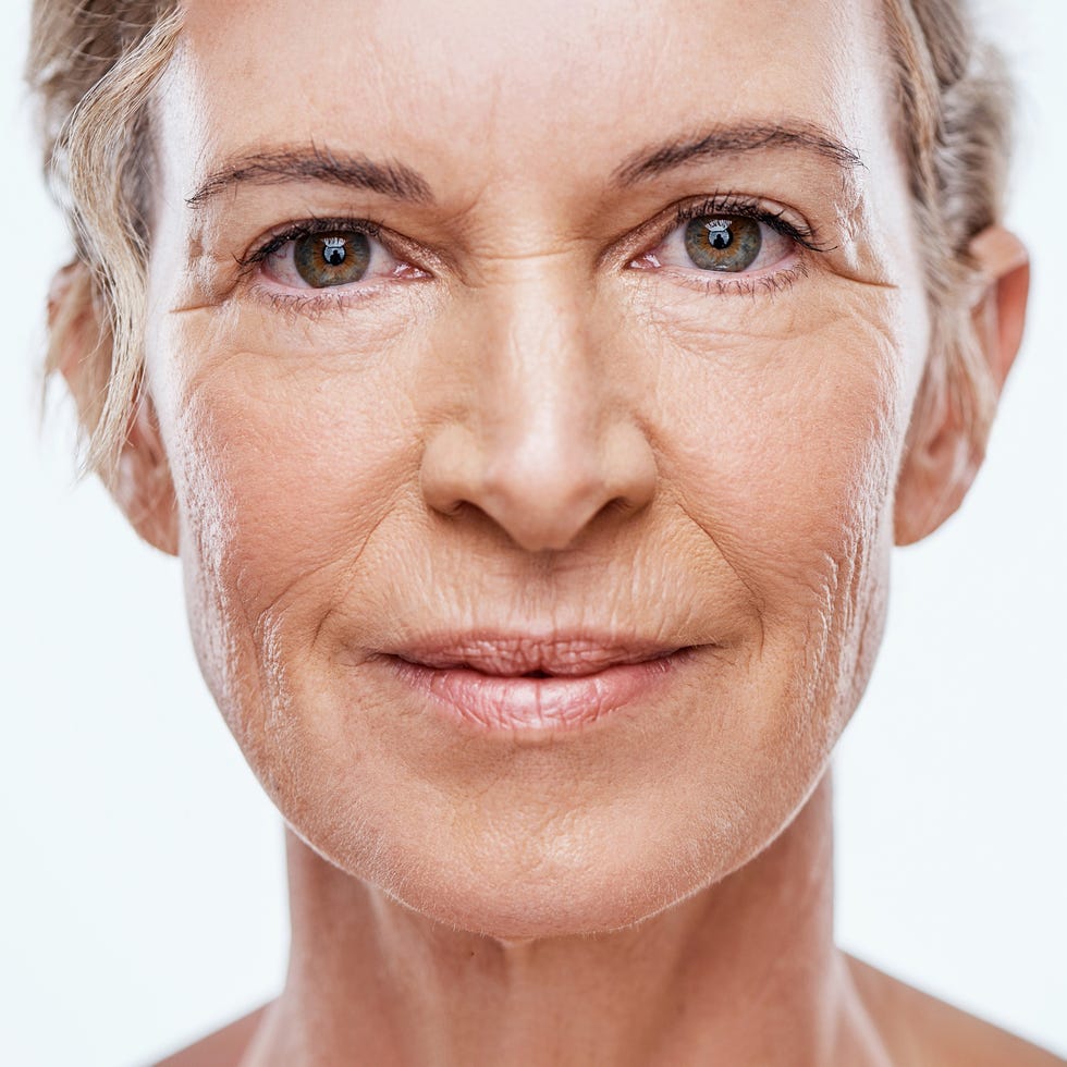 shot of a beautiful mature woman posing against a white background