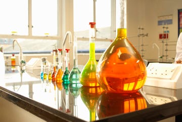 Beakers of liquid in factory