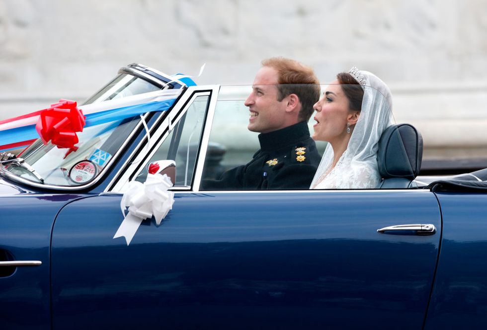 london, united kingdom   april 29 embargoed for publication in uk newspapers until 24 hours after create date and time prince william, duke of cambridge and catherine, duchess of cambridge leave buckingham palace on route to clarence house, driving prince charles, prince of waless 1969 aston martin db6 volante decorated with l plates, bunting, ribbons and balloons, following their wedding reception on april 29, 2020 in london, england the marriage of prince william, the second in line to the british throne to catherine middleton was led by the archbishop of canterbury and was attended by 1900 guests, including foreign royal family members and heads of state thousands of well wishers from around the world have also flocked to london to witness the spectacle and pageantry of the royal wedding photo by max mumbyindigogetty images