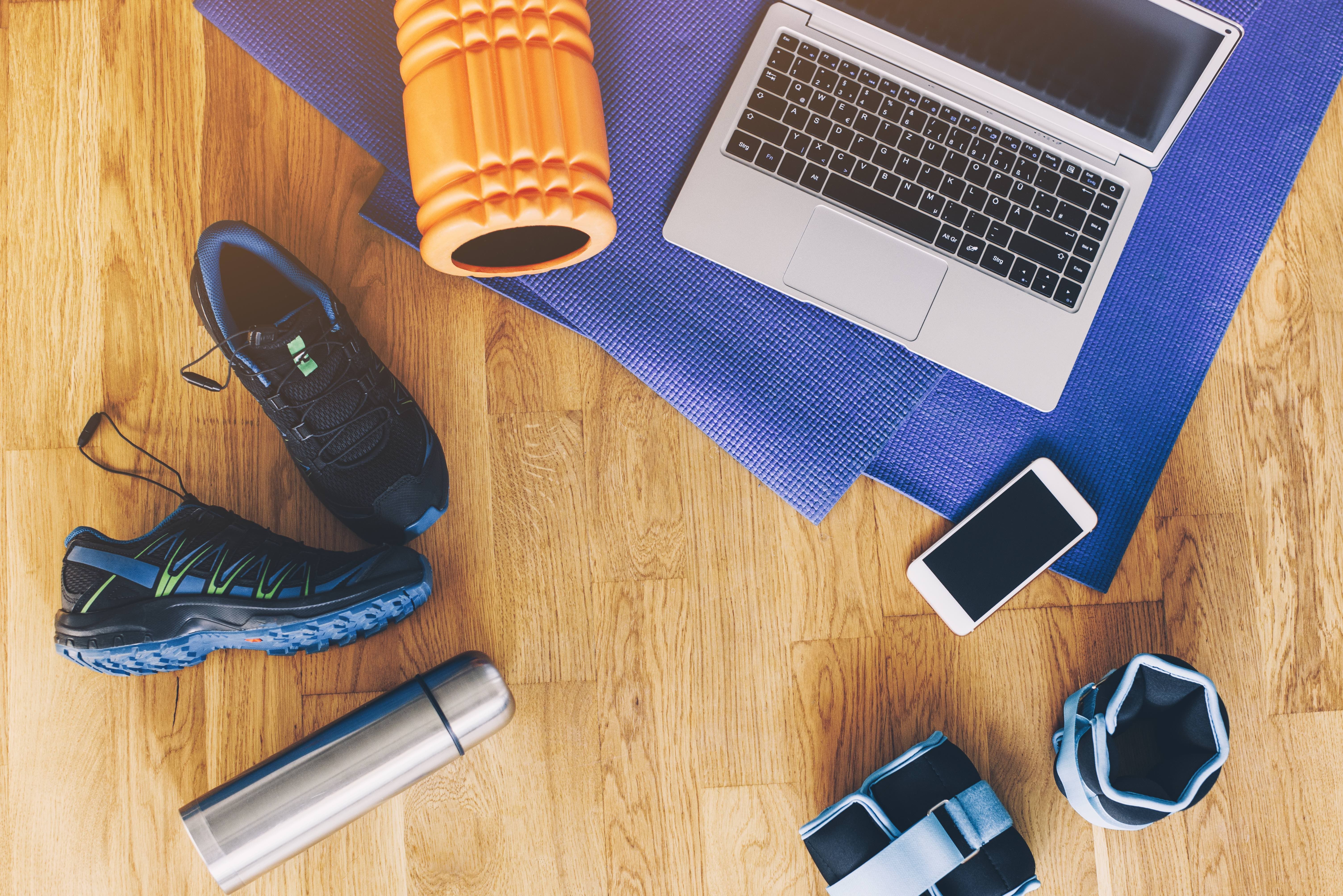 Health and fitness concept flatlay with exercise equipment on