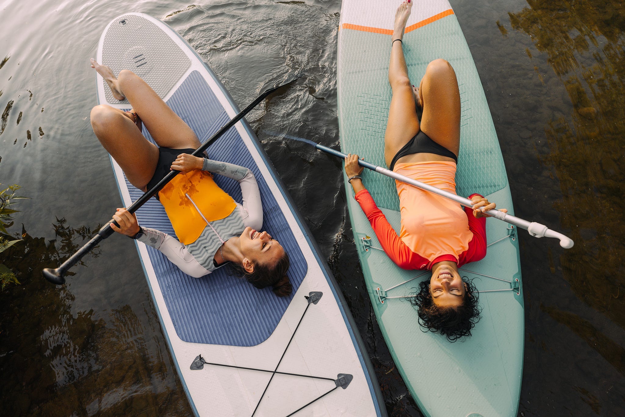 two women paddle boarding