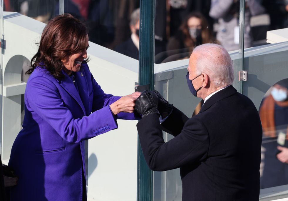 washington, dc   january 20  vice president kamala harris celebrates with president elect joe biden after being sworn in during the inauguration on the west front of the us capitol on january 20, 2021 in washington, dc  during todays inauguration ceremony joe biden becomes the 46th president of the united states photo by tasos katopodisgetty images
