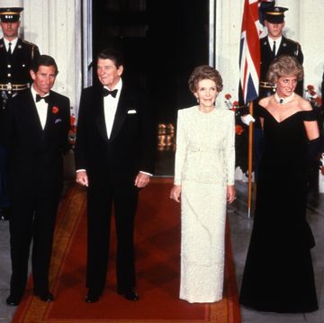 washington, dc   november 09 prince charles, prince of wales l and diana, princess of wales r, wearing a midnight blue velvet, off the shoulder evening gown designed by victor edelstein, pose for a photograph with us president ronald reagan 2nd l and first lady nancy reagan 2nd r at the white house on november 9, 1985 in washington, dc photo by anwar husseingetty images