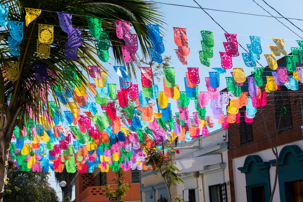mexico is a colourful country and decorations on the streets are common everywhere and bunting is one of the most popular colourful decorations seen on the streets of mazatlan sinaloa mexico