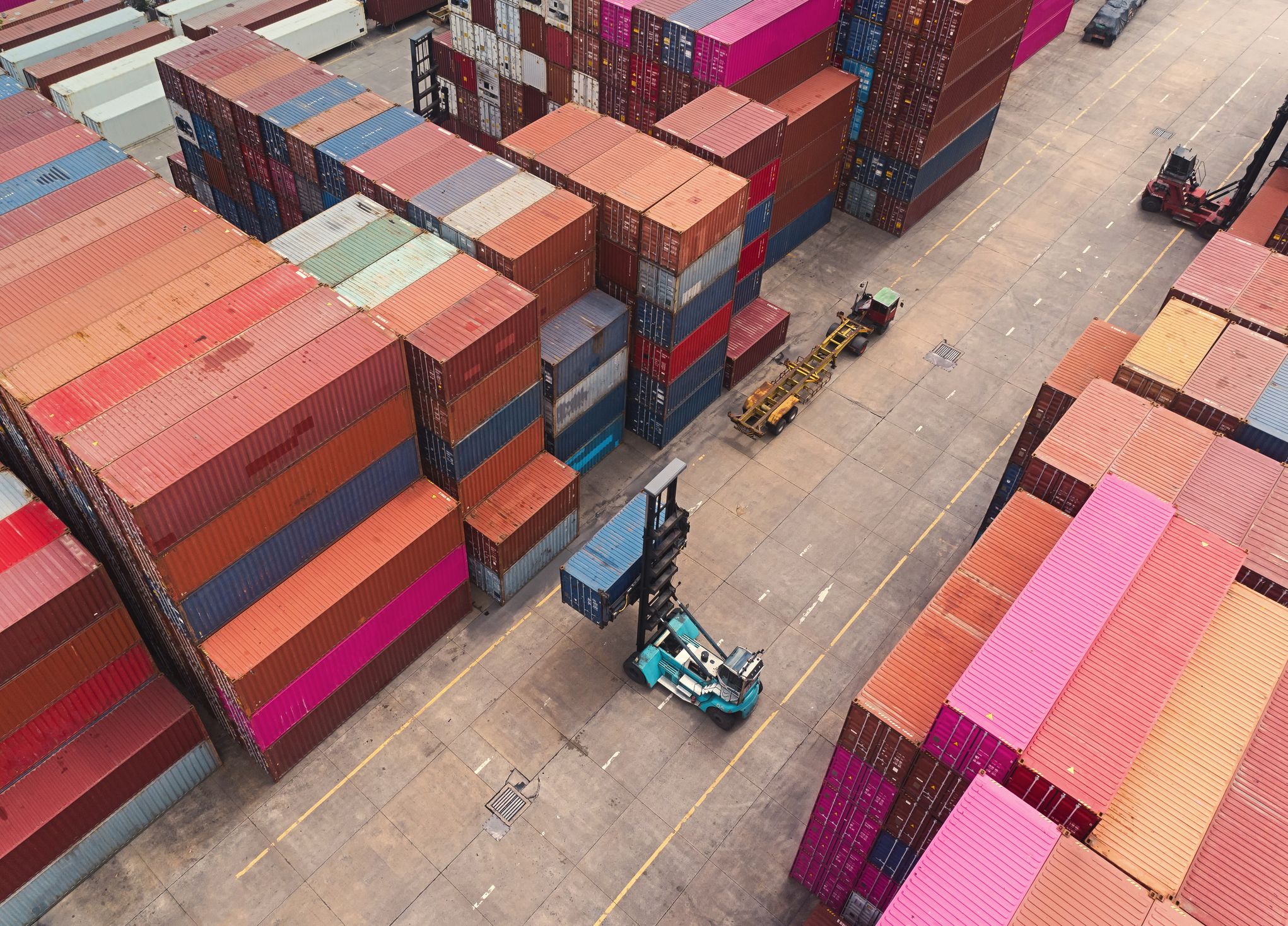 forklift handling container at terminal commercial port for business logistics, import export shipping or freight transportation