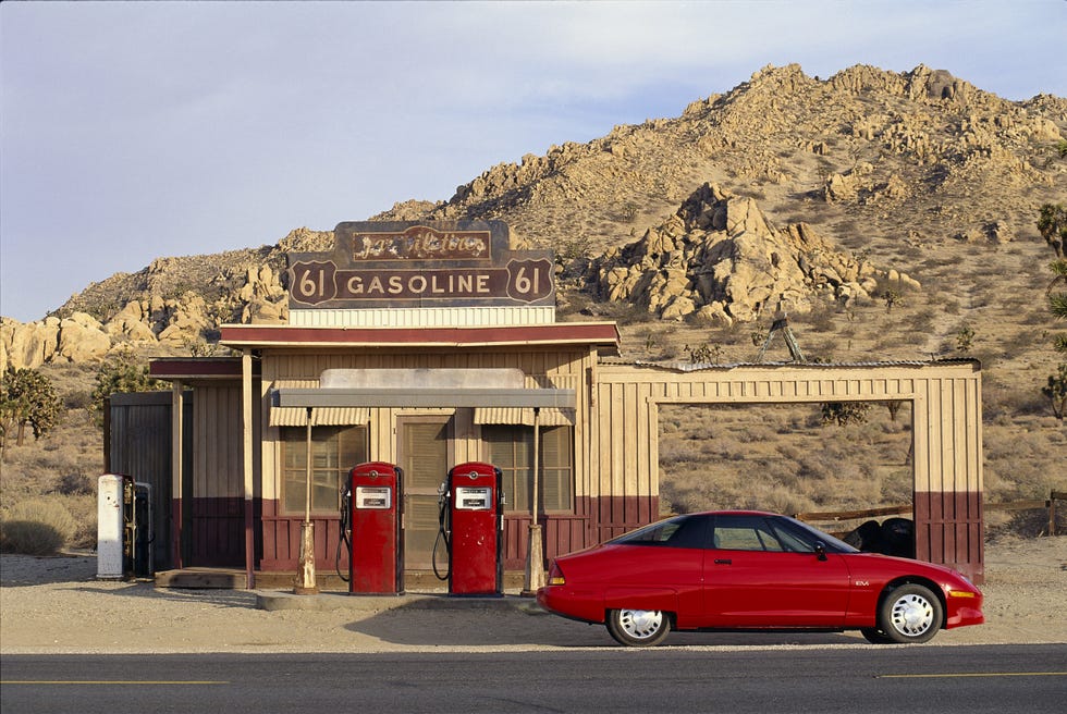 lancaster, california   april 1997  electric car , red saturn ev 1, parked at a gas station   photo by john b carnettbonnier corp via getty images