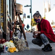 Lawrence Ferlinghetti Death - Response at City Lights san francisco, ca feb 23 a woman lights incense at a memorial outside city lights bookstore in remembrance of co founder lawrence ferlinghetti, a poet, publisher, painter, a pivotal figure to the beats movement, after the news of his death at the age of 101, in san francisco, california tuesday, february 23, 2021stephen lam the san francisco chronicle via getty images