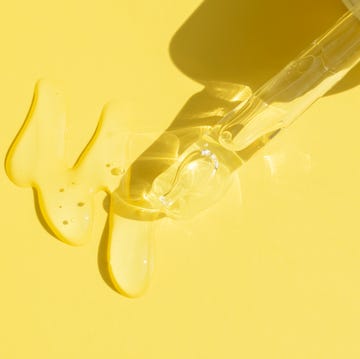 close up of pipette with pouring liquid serum and shadows what is niacinamide