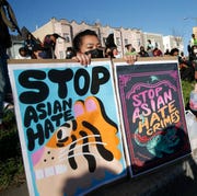 Chinatown Anti-Asian Hate Vigil oakland, ca march 23 annie hong, of oakland, holds signs during an anti asian hate vigil at chinatowns madison park in downtown oakland, calif, on tuesday, march 23, 2021 today marks the one week anniversary of the murder of eight people at atlanta spas, 6 of whom were asian women jane tyskadigital first mediaeast bay times via getty images