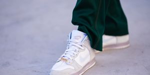 paris, france   march 24 clement cornebize, fashion model, wears green jogger sport pants from sies marjan, white sneakers shoes from nike x slamjam, on march 24, 2021 in paris, france photo by edward berthelotgetty images