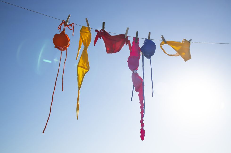 time and desire for the summer season, colorful womens costumes lying in the sun to dry