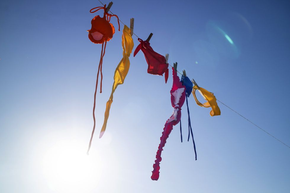 time and desire for the summer season, colorful womens costumes lying in the sun to dry