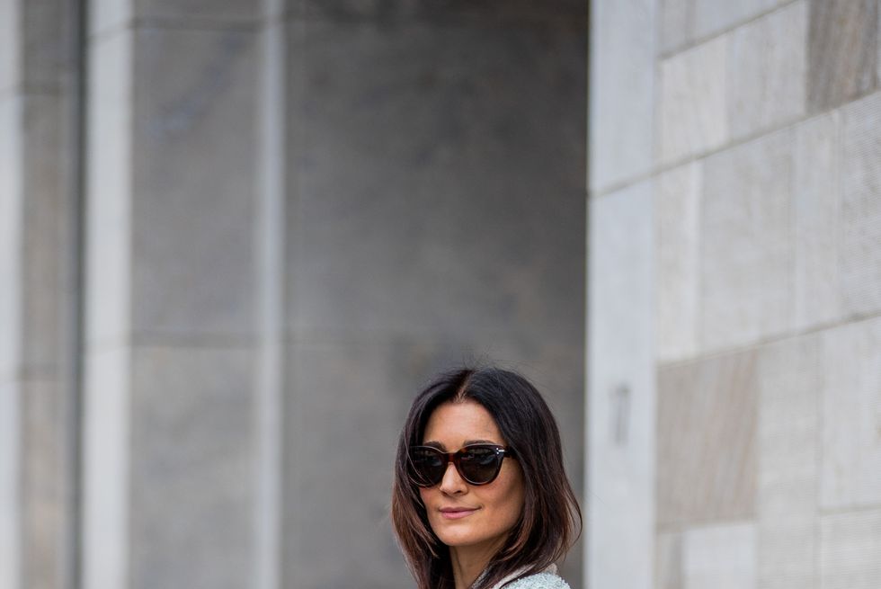 cologne, germany may 21 golestaneh mayer uellner is seen wearing white shirt, beige paperbag pants isabel marant, dad sandals marni, turquoise bag chanel, necklace tiffany, sunglasses celine, jacket chanel on may 21, 2021 in cologne, germany photo by christian vieriggetty images