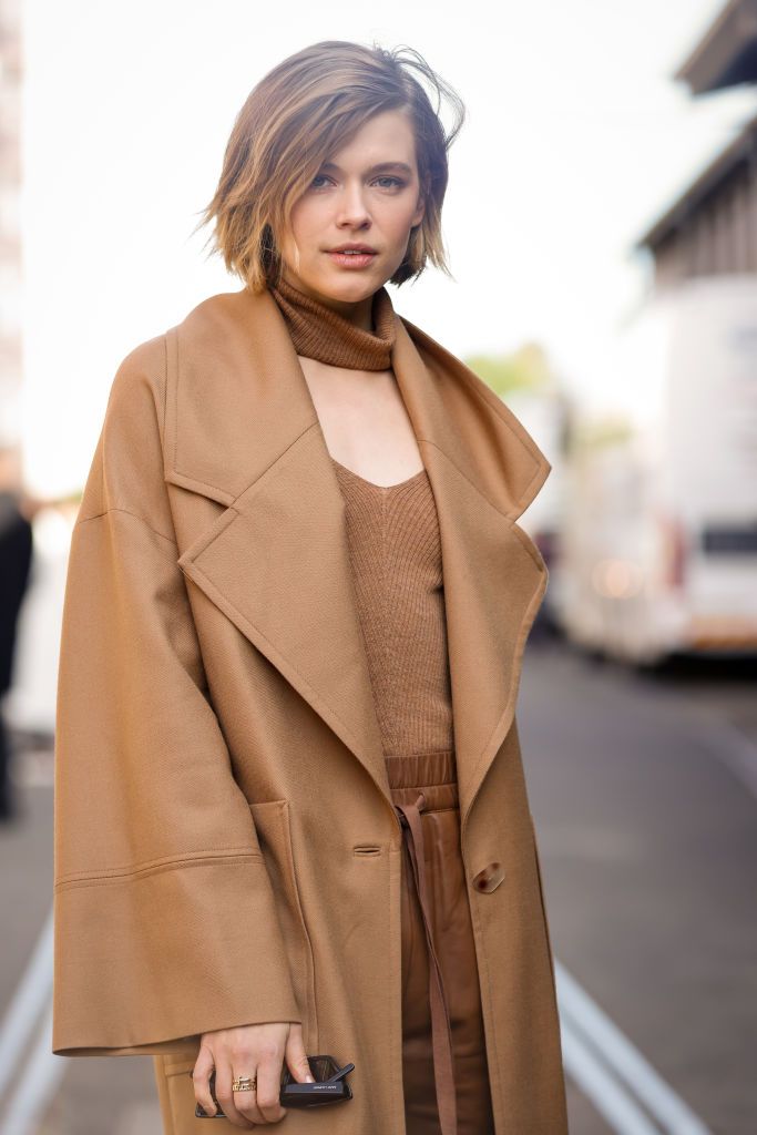sydney, australia   june 01 editors note image was created in camera using a reflective surface victoria lee wearing beige oroton  trench wool coat and chanel shoes at afterpay australian fashion week 2021 on june 01, 2021 in sydney, australia photo by hanna lassengetty images