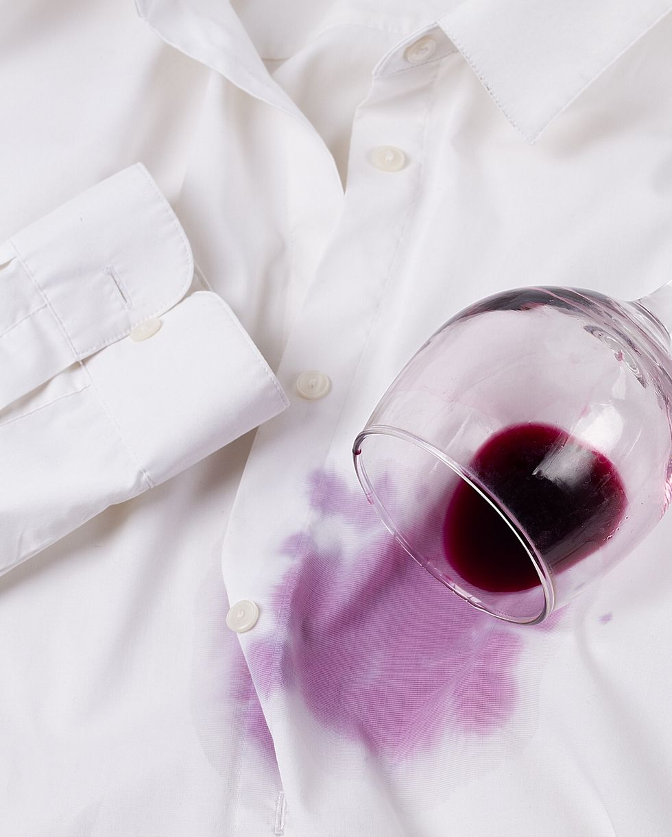 concept wine glass spilled on a white shirt, no people, horizontal, concept, top view, high quality photo