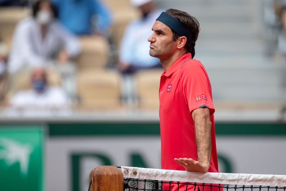 paris, france june 3 roger federer of switzerland has an on court row with umpire emmanuel joseph during his match against marin cilic of croatia on court philippe chatrier during the second round of the singles competition at the 2021 french open tennis tournament at roland garros on june 3rd 2021 in paris, france photo by tim claytoncorbis via getty images