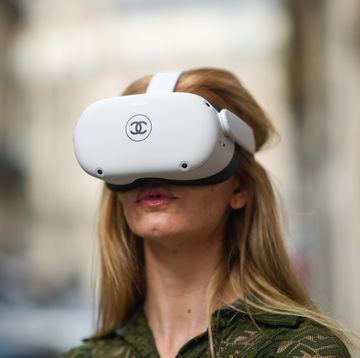 paris, france   june 04 natalia verza mascaradaparis wears a green khaki mesh jumpsuit from fendi with embroidered logo  monograms, and is playing with a vr  virtual reality oculus quest headset with a printed chanel logo, and equipped with 2 controllers, on june 04, 2021 in paris, france photo by edward berthelotgetty images