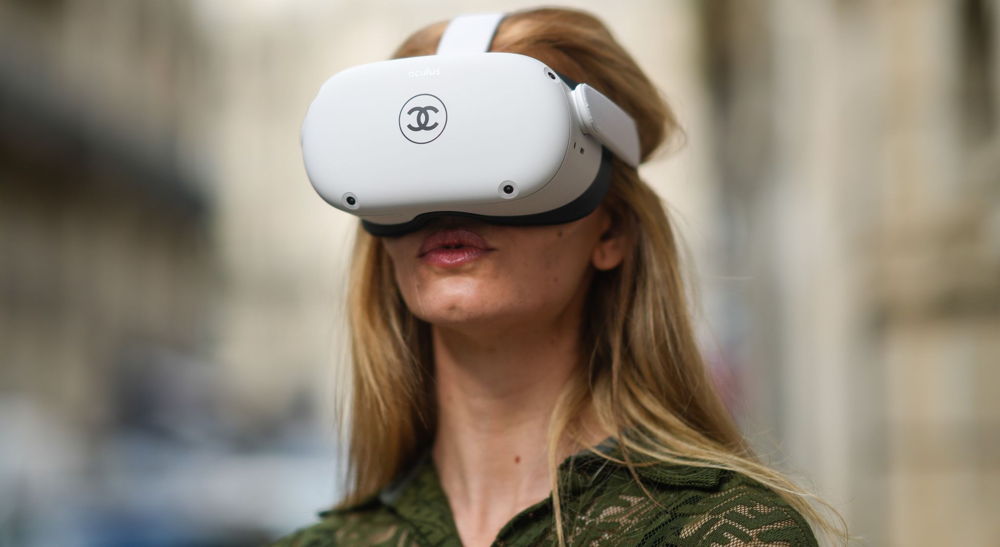 paris, france   june 04 natalia verza mascaradaparis wears a green khaki mesh jumpsuit from fendi with embroidered logo  monograms, and is playing with a vr  virtual reality oculus quest headset with a printed chanel logo, and equipped with 2 controllers, on june 04, 2021 in paris, france photo by edward berthelotgetty images