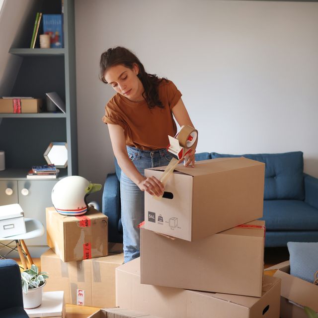a young woman moving into a new apartment