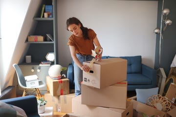 a young woman moving into a new apartment