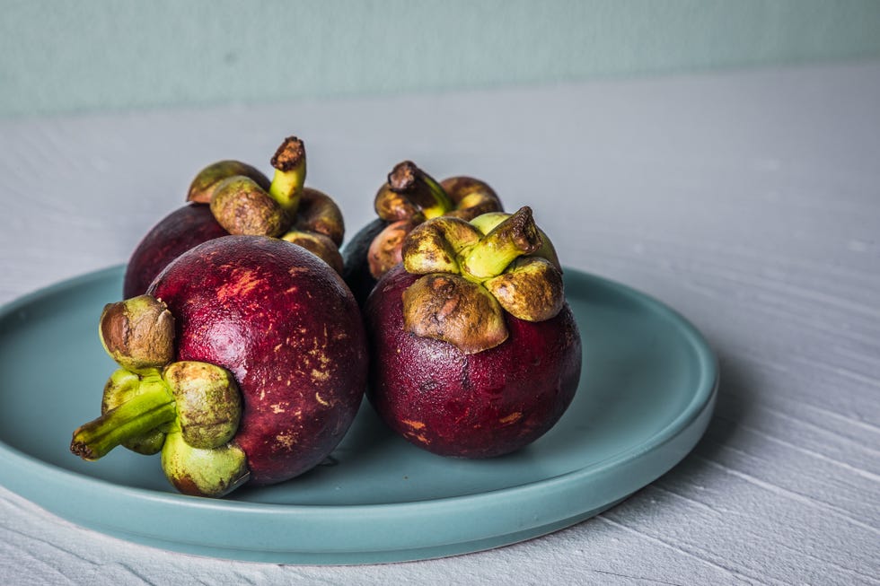 plate of mangosteen in the rind