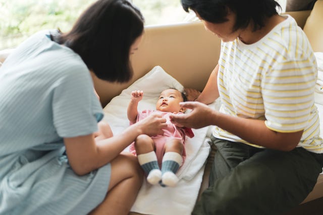 grandmother very happy and enjoying spending time with daughter and granddaughter