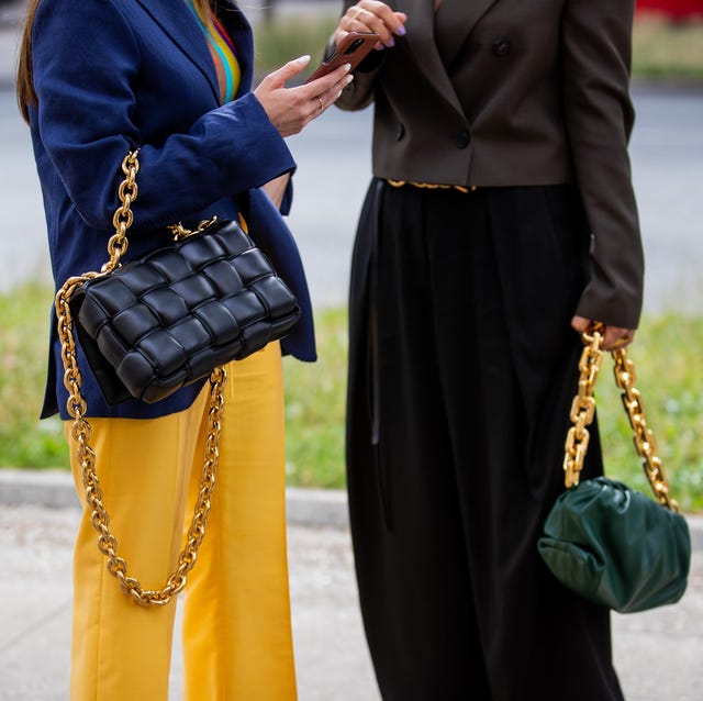 paris, france july 08 julia comil is seen wearing bottega veneta bag, blue blazer, yellow pants and gili biegun wearing green bottega bag outside vaishali s on july 08, 2021 in paris, france photo by christian vieriggetty images