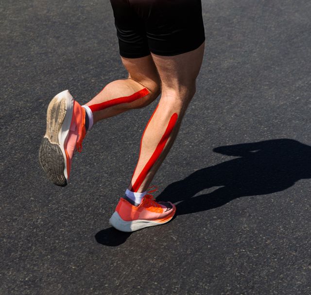 man running with kinesio tape on his calves