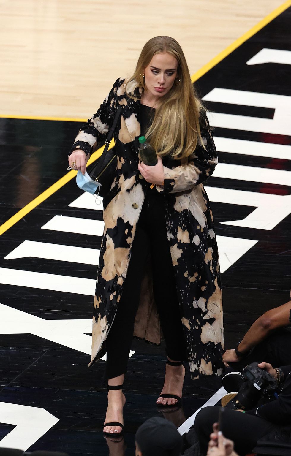 phoenix, arizona   july 17 singer adele looks walks in during the second half in game five of the nba finals between the milwaukee bucks and the phoenix suns at footprint center on july 17, 2021 in phoenix, arizona note to user user expressly acknowledges and agrees that, by downloading and or using this photograph, user is consenting to the terms and conditions of the getty images license agreement  photo by ronald martinezgetty images