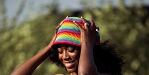 copenhagen, denmark   august 12 guest wearing pink pants, brown and pink knitted top and colorful rainbow hat outside ganni during copenhagen fashion week ss22 on august 12, 2021 in copenhagen, denmark photo by raimonda kulikauskienegetty images