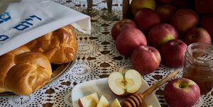 rosh hashana holiday table with apples and honey