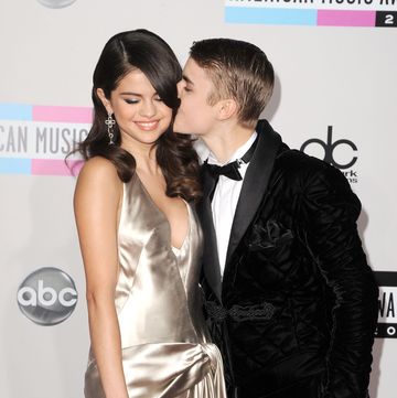 los angeles, ca november 20 l r singer selena gomez and singer justin bieber arrive at the 2011 american music awards held at nokia theatre la live on november 20, 2011 in los angeles, california photo by steve granitzwireimage