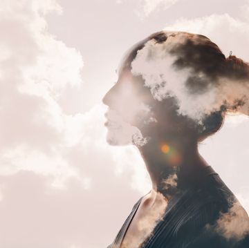 psychology and woman mental health concept multiple exposure clouds and sun on female head silhouette