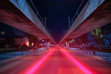 visualizing 5g with red light trails connecting urban spots in finite vanishing point