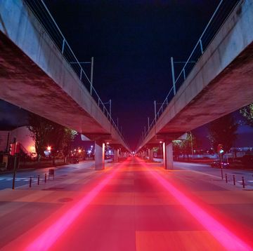 visualizing 5g with red light trails connecting urban spots in finite vanishing point