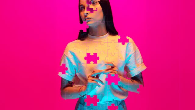 a figure holds a small object with puzzle pieces overlaying the upper part of their body