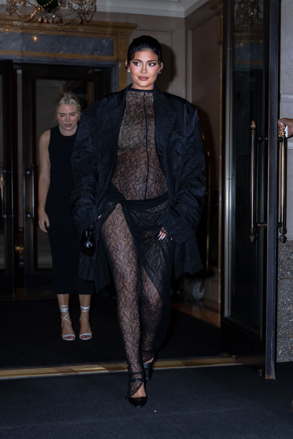 Kylie Jenner Shows Her Underwear in a Sheer Black Lace Dress