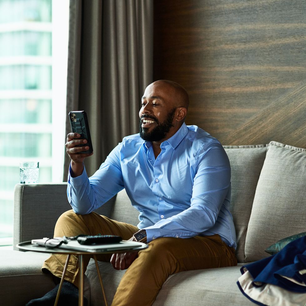 mature black businessman calling significant other on video call