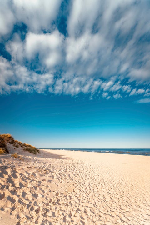 amazing white sand beach in sandhammaren, sweden popular tourist destination in summer season