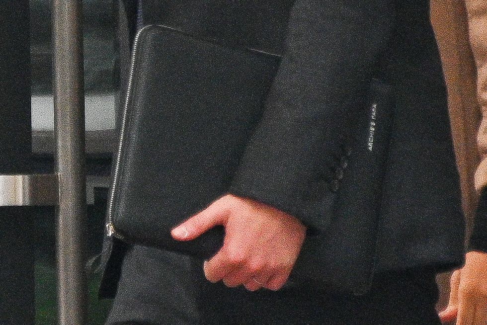 new york, new york   september 23 prince harry, duke of sussex, with a portfolio briefcase inscribed with “archie’s papa,” is seen leaving 50 united nations plaza on september 23, 2021 in new york city photo by alexi rosenfeldgc images