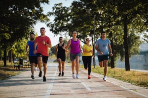 young running team working out near the river